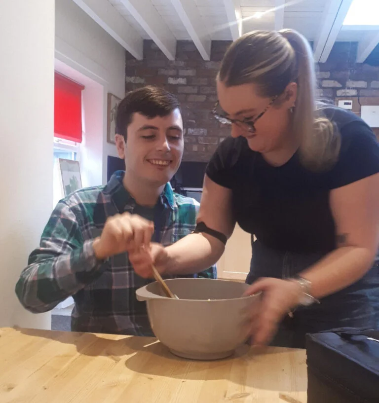Two individuals baking